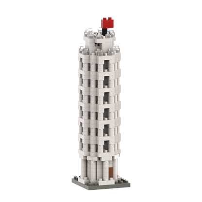 The Brixies Small Gift Box Leaning Tower Of Pisa is a micro-brick model featuring white and gray pieces, a flat base, and a small red flag on top, capturing the iconic monument in miniature form.