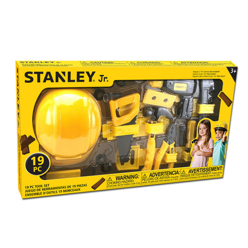 The Red Toolbox Stanley Jr. 19 Piece Pretend Play Tool Set comes in yellow and black packaging with a kid-sized toolbox, toy hard hat, tools, images of kids in construction hats, safety warnings on the box, and is suitable for ages 3+.