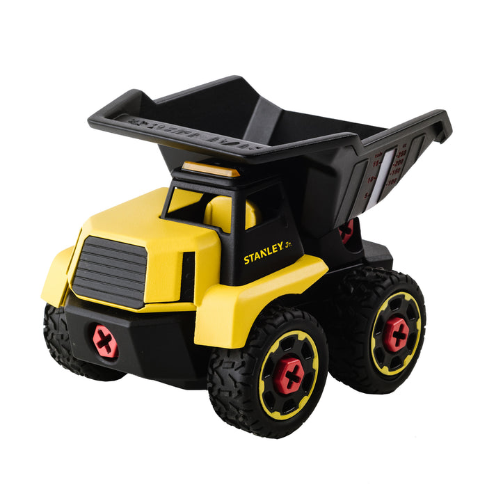 The Stanley Jr. Take Apart XL Dump Truck by Red Toolbox is a yellow and black construction toy with rugged wheels, red hubs, a tilted black dump bed, and "STANLEY" printed on the side.