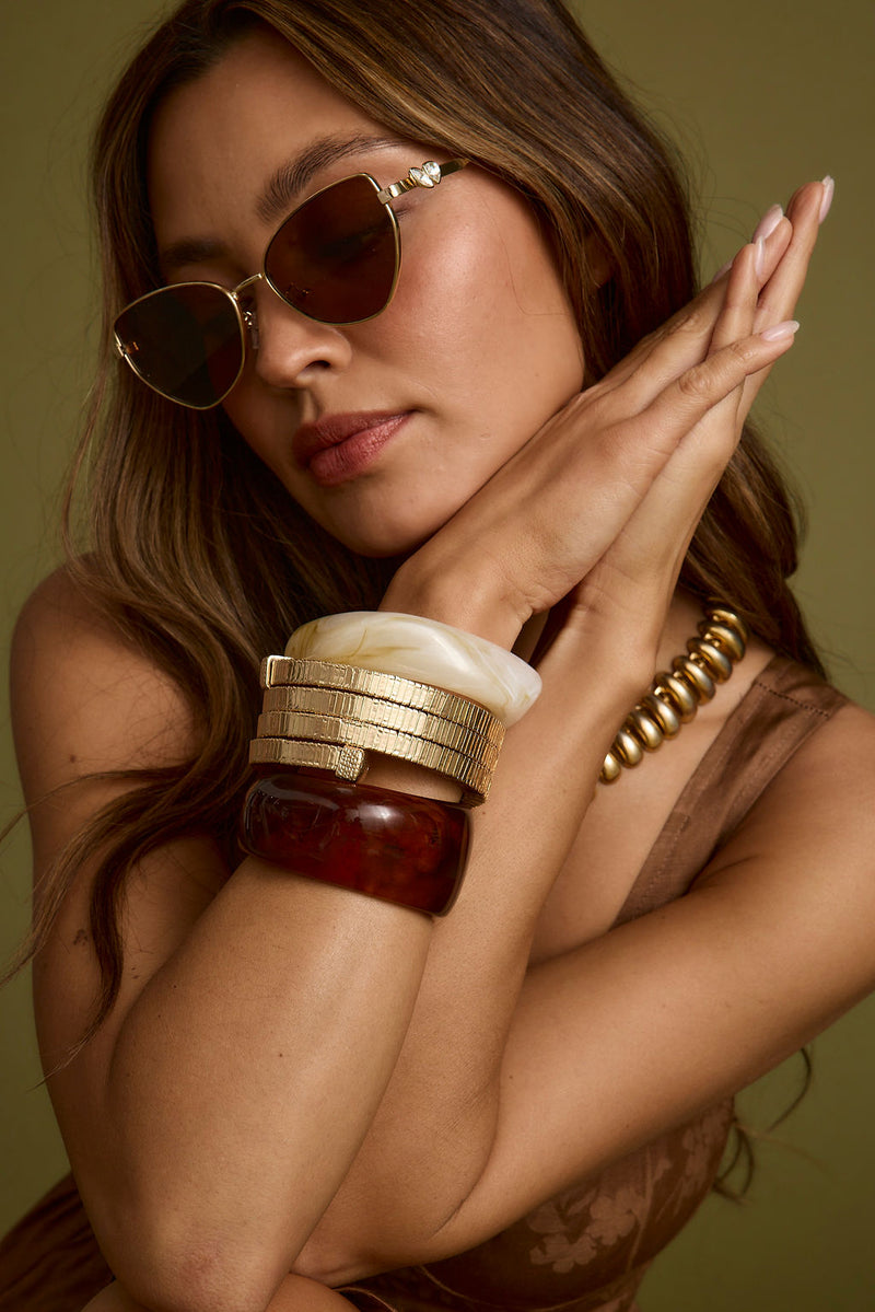Tabby Set of 2 Chunky Bangles paired with complementary accessories for a polished look.