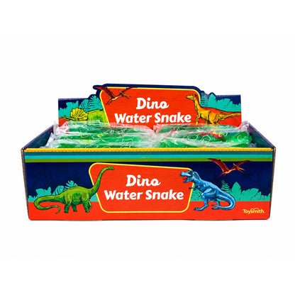 A Toysmith Dino Water Snake display box features vibrant dinosaur illustrations and holds several individually packaged green water snake toys by Toysmith, creating a fun, fidget-friendly sensory experience for kids.