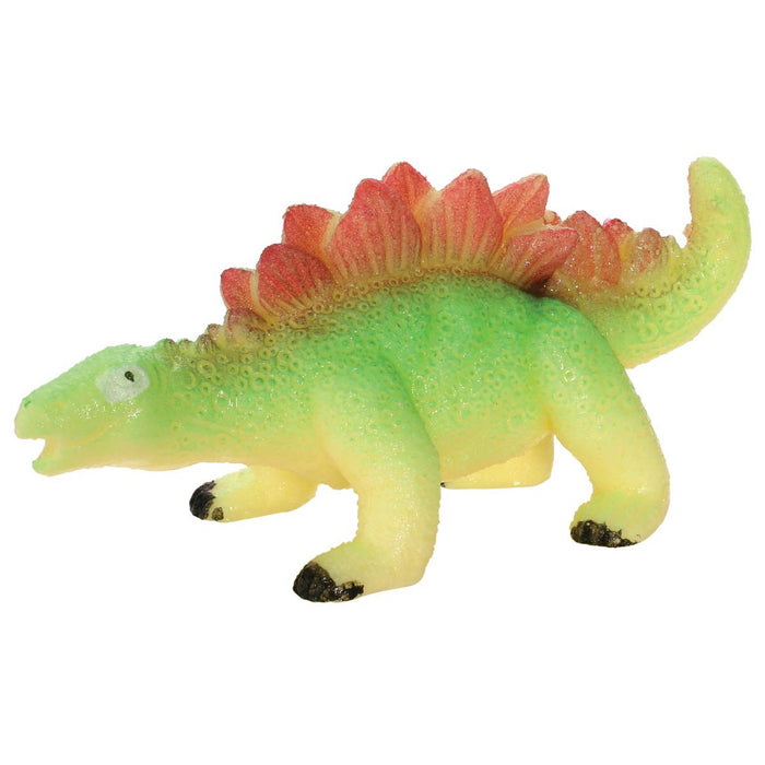 The Toysmith Ginormous Hatchin' Grow Dino Egg by Toysmith features a green and yellow rubber Stegosaurus toy with red back plates, perfect for kids’ activities or adding to a Hatchin' Grow Dino Egg collection.